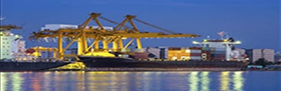 Image of shipping yard with two yellow cranes