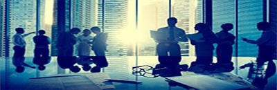 Business professionals reading reports in an office building