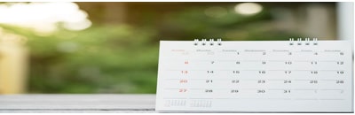 An image of a calendar in front of a window